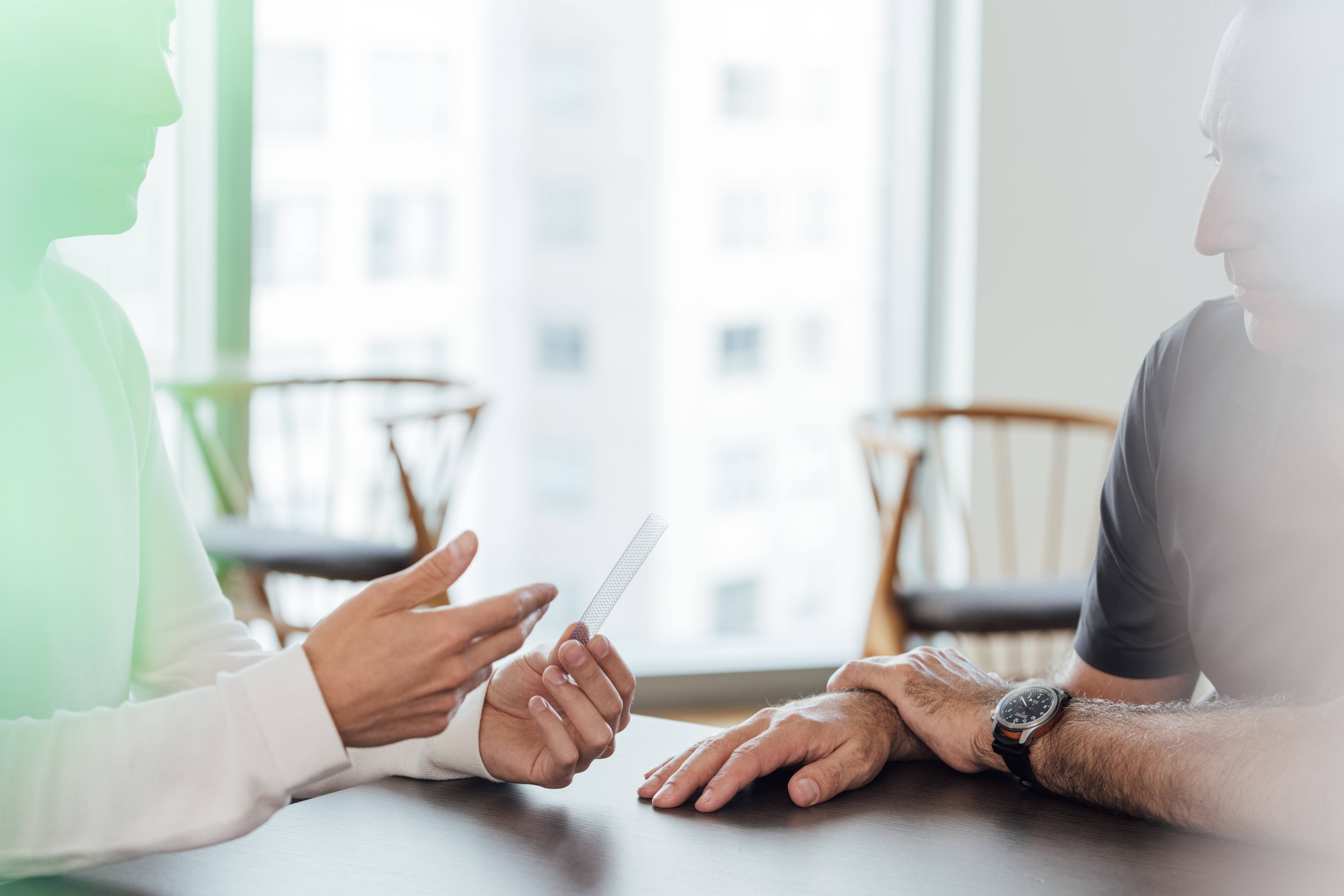 Doctor explaining stent to pet owner