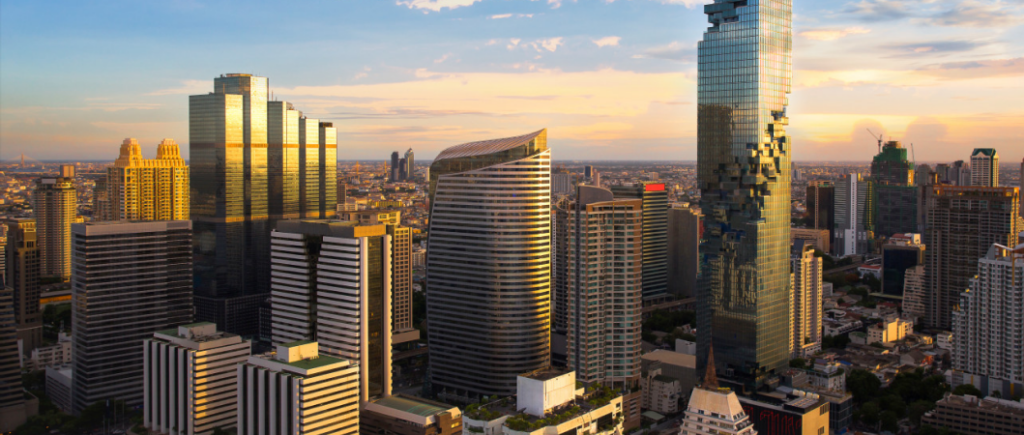 Bangkok cityscape captured during the enchanting golden hour, showcasing the warm hues illuminating the skyline.